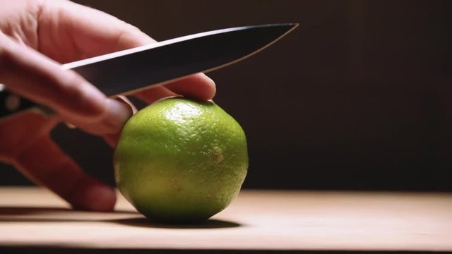 Cutting a lime in slow motion