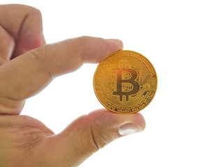 Hand holding golden Bitcoin virtual money.