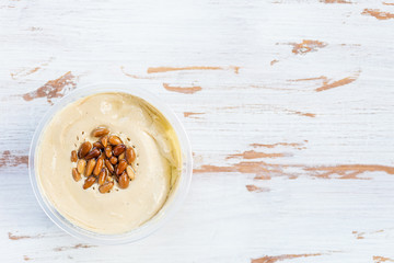 Classic Hummus made from Chickpeas with Pine Nuts on Top