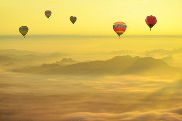 Hot air balloon over the sea of mist.