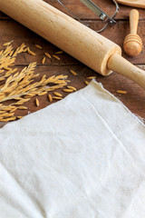 bakery ingredients on wood table with soft-focus and over light in the background