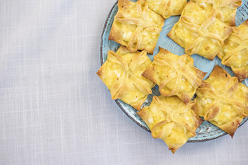 A festive table with cups of flowers and fruits. Delicious cake and cookies