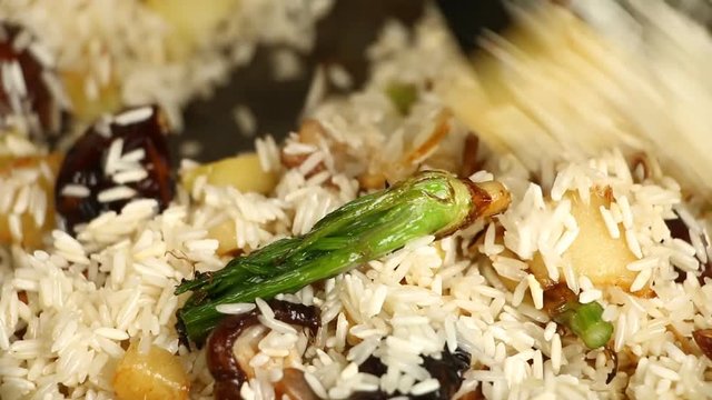 Frying rice with ginger shiitake and celery root  in pan