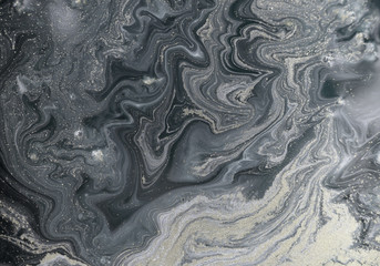 Marble abstract acrylic background. Nature marbling artwork texture. Golden glitter.