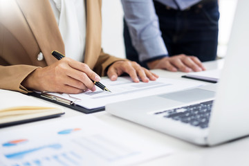 Administrator business man financial inspector and secretary making report, calculating balance....