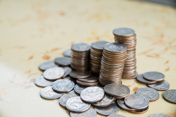 step of coins stacks on the table, money, saving and investment or family planning concept.