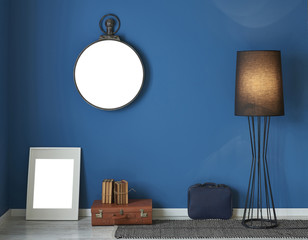 dark blue room frame suitcase and modern lamp