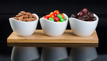 almond, chocolate and date on a background