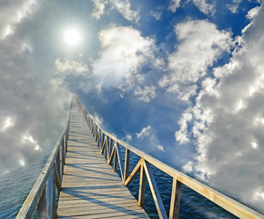 road bridge to hevesn paradise sun clouds