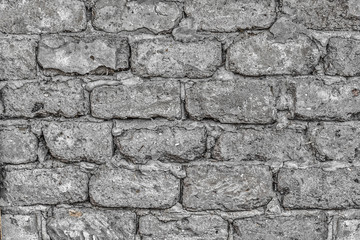 Wall made of big rough concrete blocks as background.
