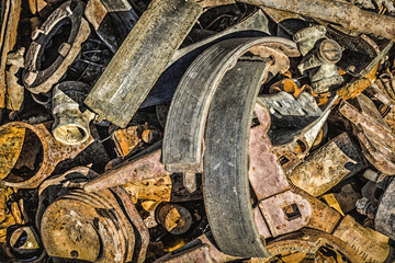 Old rusty parts and tools for repair of machinery.