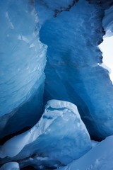 Textured blue ice and snow deep in an Ice Cave in Canada