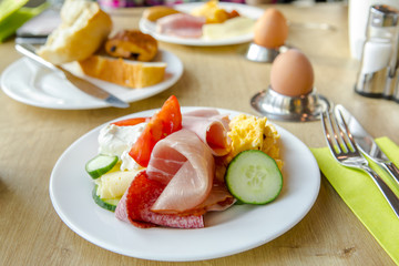 Bright and healthy breakfast, raw vegetables salad, fresh lettuce, cheese shakes, Western fried egg with the original bread,
