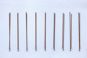 Armature prepared for pouring walls, covered with snow.