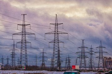 High voltage power lines against the background of the evening sky.