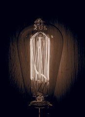 Vintage bulb sepia wood background