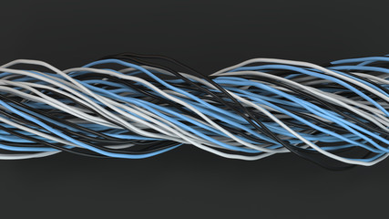 Twisted black, white and blue cables and wires on black surface
