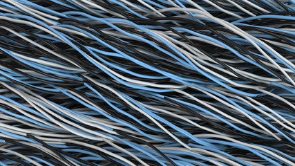 Twisted black, white and blue cables and wires on black surface
