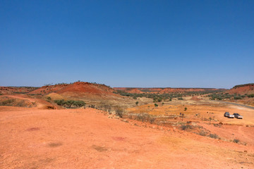 Camper trailers parked in dry landscape at Cawnpore Lookout in Outback Queensland