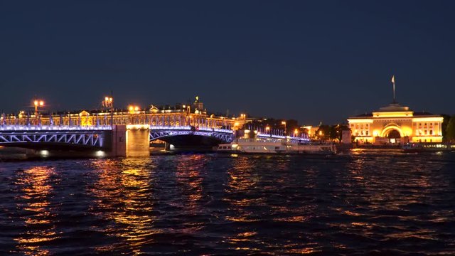 Passenger ship sails under the Palace Bridge. Evening time St. Petersburg