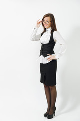 Full length portrait of beautiful caucasian young smiling brown-hair business woman in black suit, white shirt and glasses isolated on white background. Manager or worker. Copy space for advertisement