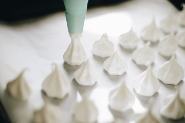 Fototapeta na wymiar home made meringues on Baking tray close up