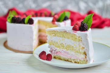 piece of fresh biscuit yoghurt white yoghurt cake with fresh raspberries and blackberries