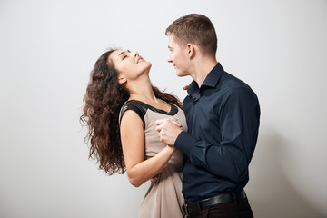 romantic couple posing on white background