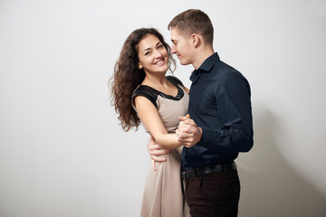 romantic couple posing on white background