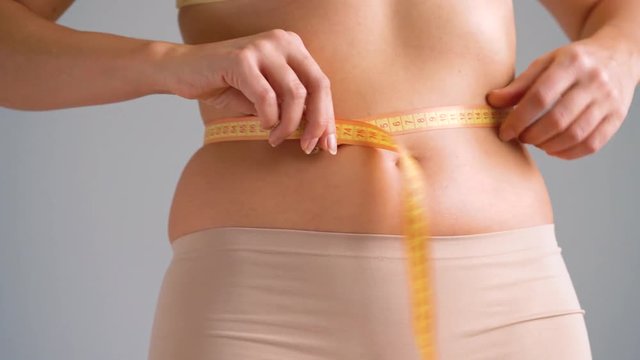Healthy waist with measuring tape