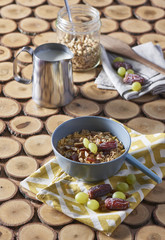 Corn bowl with sliced banana, blueberry and strawberry on wooden table, closeup view. Healthy eating, healthy breakfast dieting concept