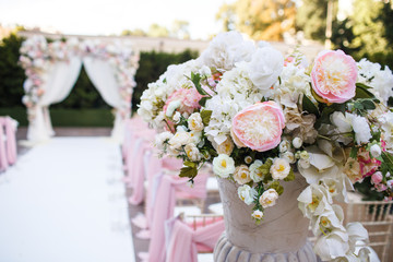 Beautiful bouquet in a vase at a wedding ceremony