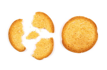 Integral crumbled rusks with wholewheat flour, bread slices isolated on white background, top view