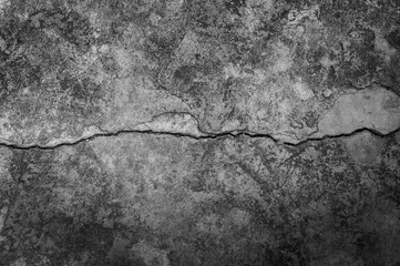 Photo sur Aluminium Pierres Mur grungy avec texture de sol en ciment à grande fissure, grande fissure en ciment pour fond sombre