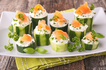 appetizer with cucumber,cheese cream and salmon