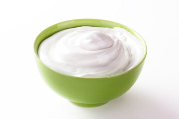Obraz na płótnie Canvas cream sour in a plate isolated white backround