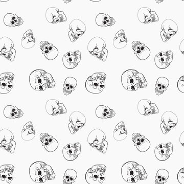 Dark skulls on white background vector pattern