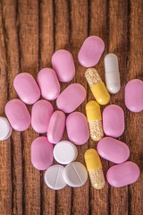 close up of tablets pills supplements vitamins