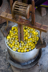 Boiling cocoon silkworm in the pot to make silk yarn