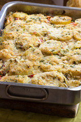Potatoes and tomatoes baked with cheese