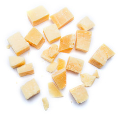 Small pieces of parmesan cheese on white background