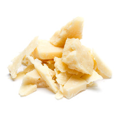 Small pieces of parmesan cheese on white background