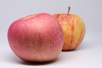  pink apple fruit with yellow apple background