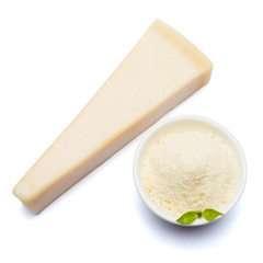 a piece of Parmesan cheese on white background with grated