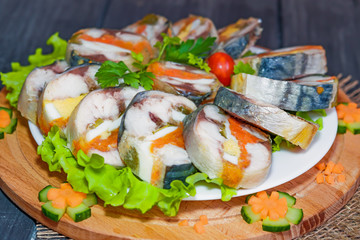 Roulade of sea fish mackerel with boiled vegetables and eggs, gala dinner, close-up