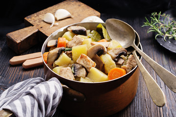 Mushroom stew on black rustic board