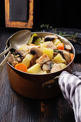 Mushroom stew on black rustic board