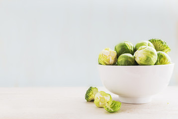 Ingredients Brussels Sprout with Broccoli, kale, and carrot on black wooden table. Selective focus