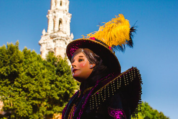 huehue Carnival scene, dancer wearing a traditional mexican folk costume and mask rich in color Mexico