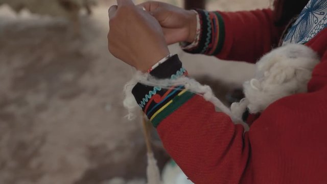 Woman make wool textile.Handmade traditional colorful wool. Peru woman make alpaca textile .